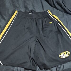 Nike Black Athletic Shorts with Yellow Stripes